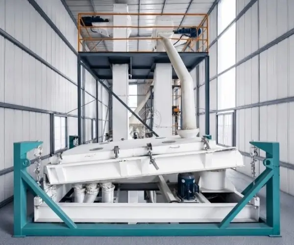 Feed screening equipment on a turquoise support frame